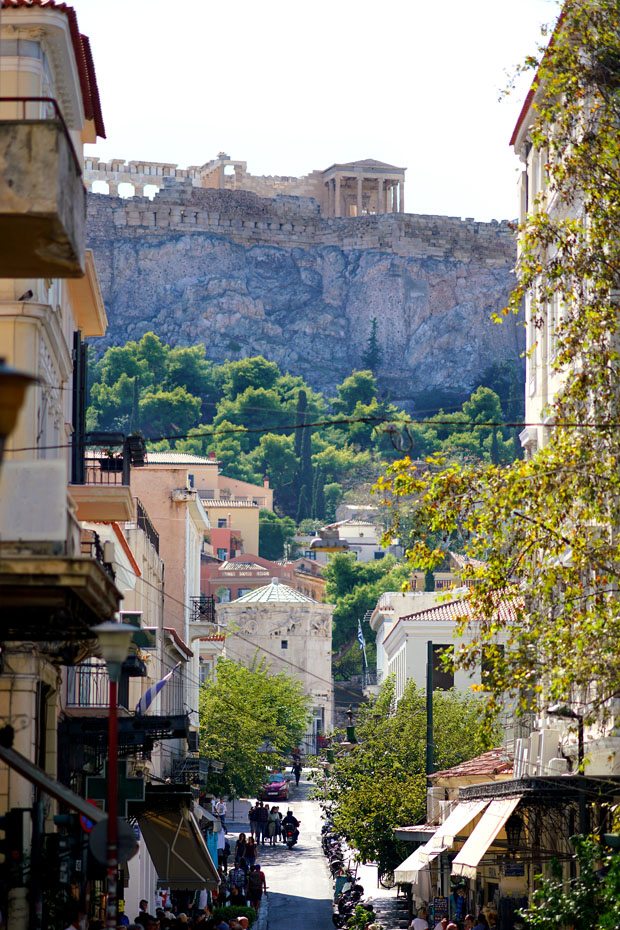 Acropolis viewed from street under sunny skies