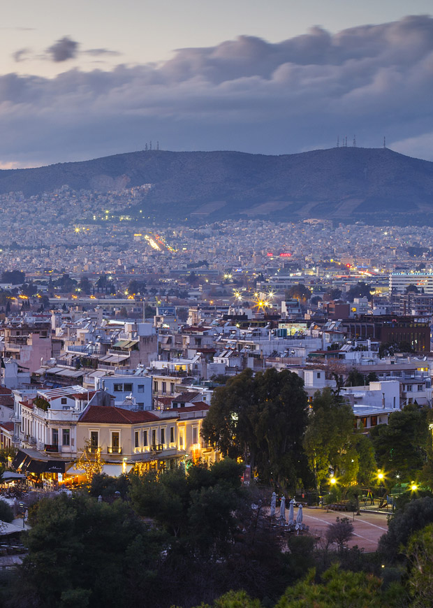 Dusk in Athens Greece, glowing lights of the city windows and balconies