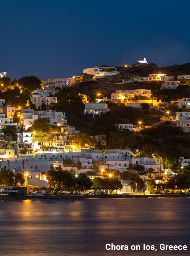 Lighted houses at night at Chora on Ios Island in Greece