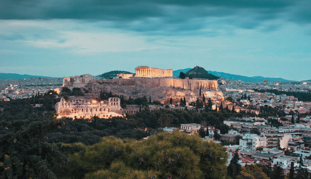 The Acropolis under heavy skies in Athens Greece