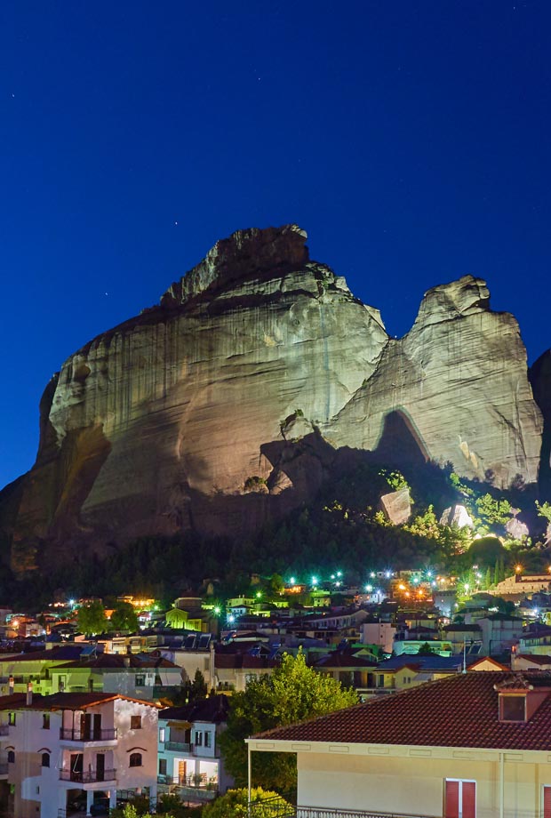Meteora at night with dramatic lighting and stars