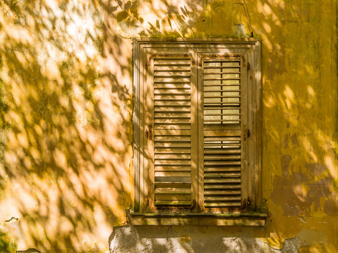 Wall and shutters in summer in Greece