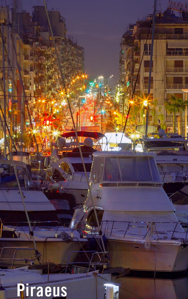 Boats and street lamps at Piraeus harbor at night