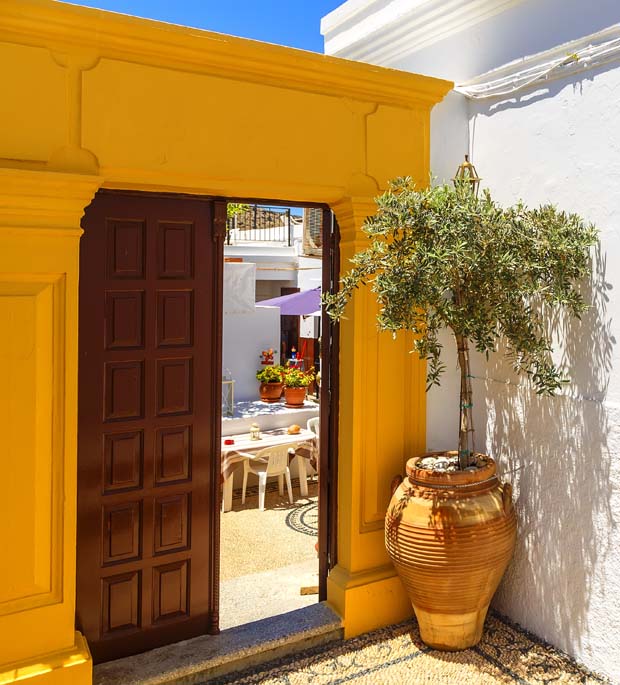 A doorway to a courtyard in Greece