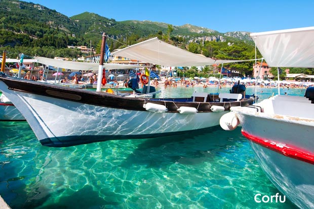 Corfu boat floating in clear water