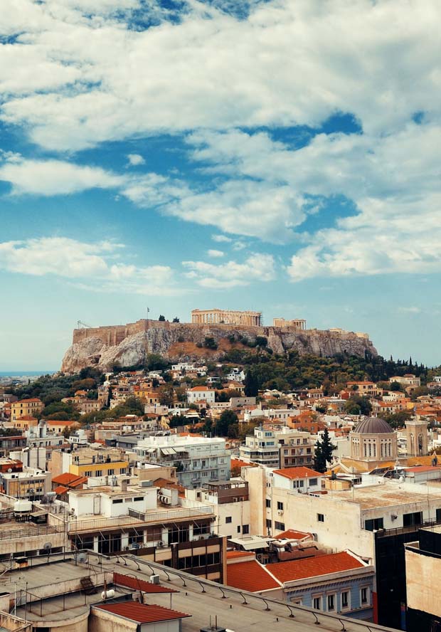 Athens Greece under sunlit day with Acropolis in the middle distance