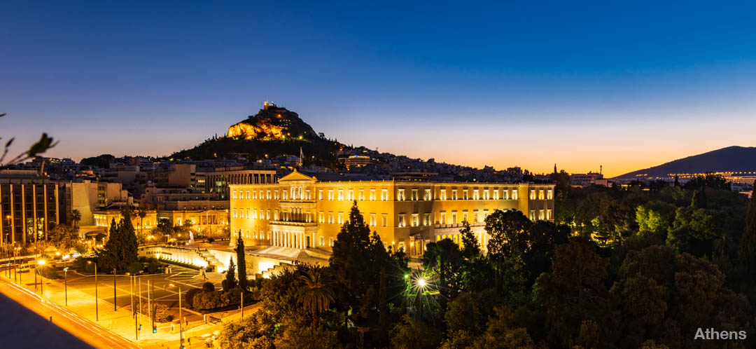 Dusk colors as night falls in Athens Greece with  Mount Lycabettus