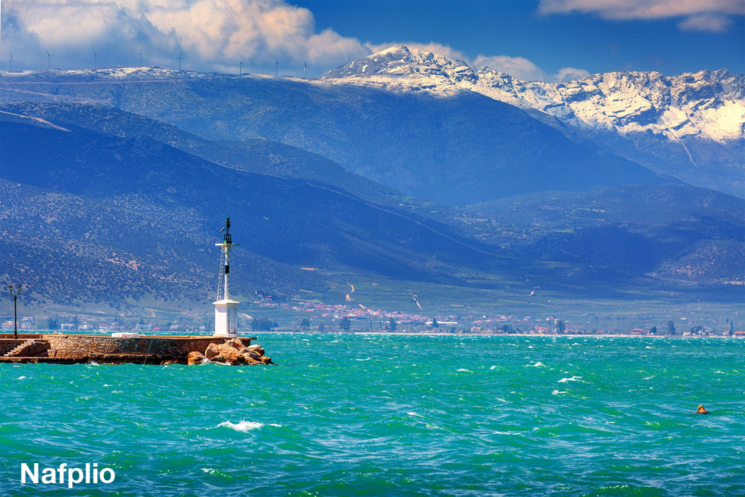 Nafplio lighthouse and snow capped mountains