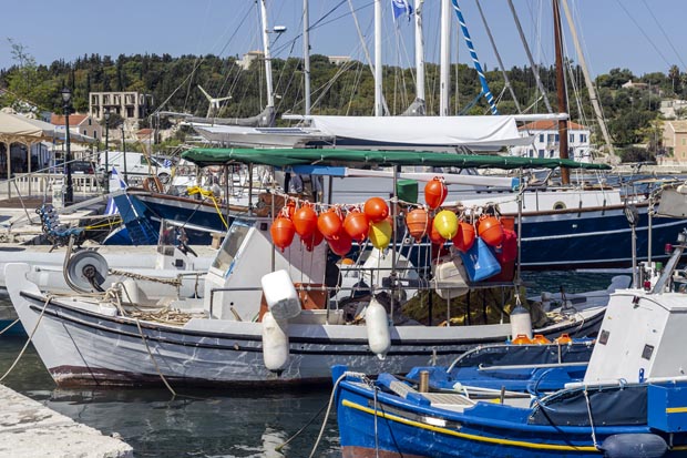 Traditional greek fishing boat moored to dock