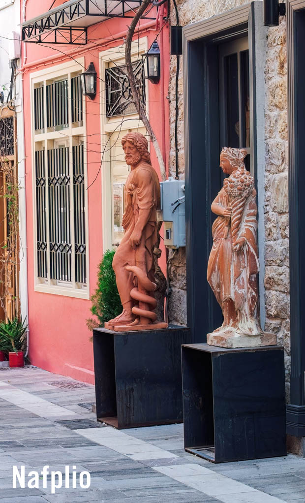 Nafplio display of Ancient Greek statue reproductions on the sidewalk