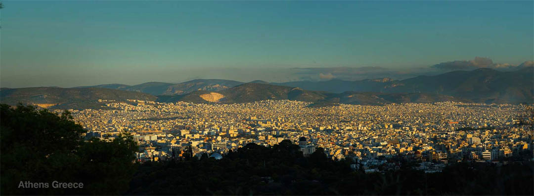 Mount Aegaleo in the center distance of photo of panormama of Athens Greece - click on the image to enlarge