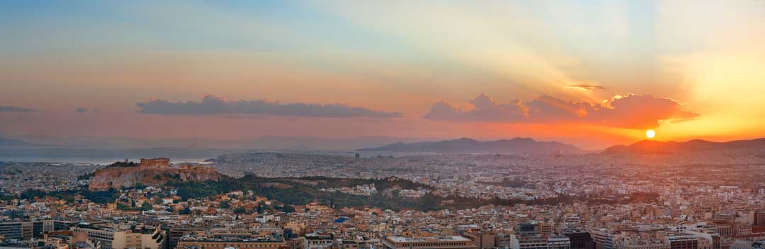 Sun setting over Athens and Mount Aegaleo