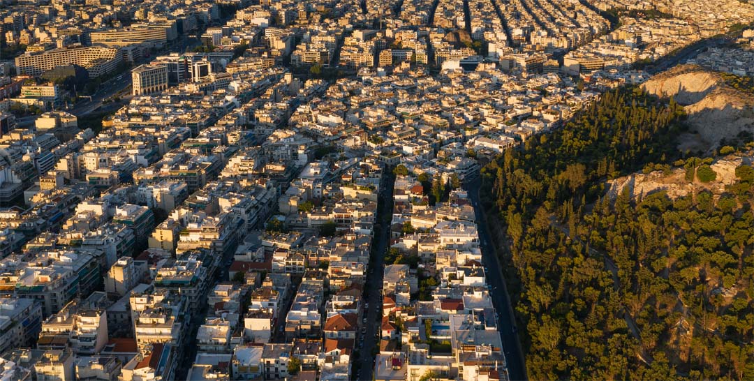 Above the rooftops of Athens view from the Acropolis looking toward the Saraonic Gulf