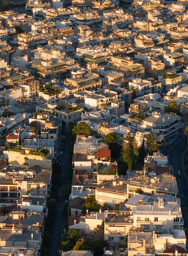 Above the rooftops of Athens view from the Acropolis looking toward the Saraonic Gulf