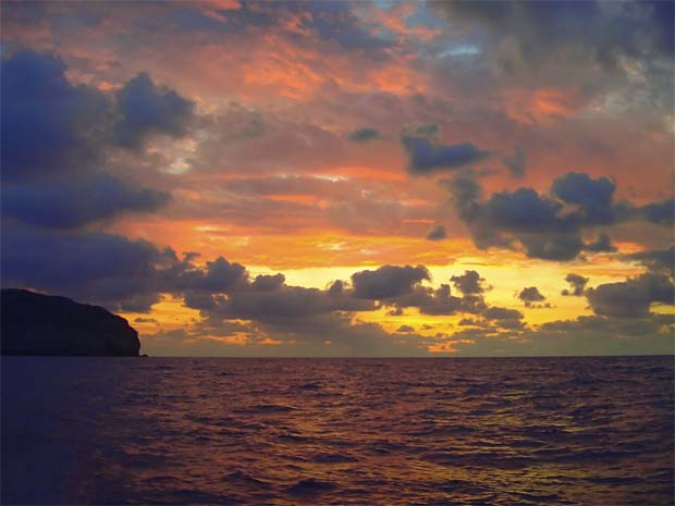 Colorful blazing sunset colors along coast