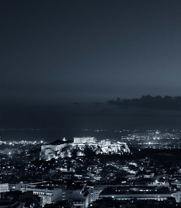 Athens at night with view of Akropolis and the Saronic Gulf