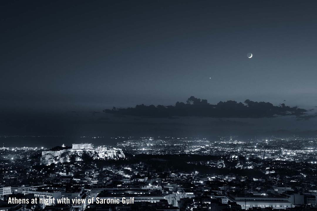 Athens at night with view of Akropolis and the Saronic Gulf