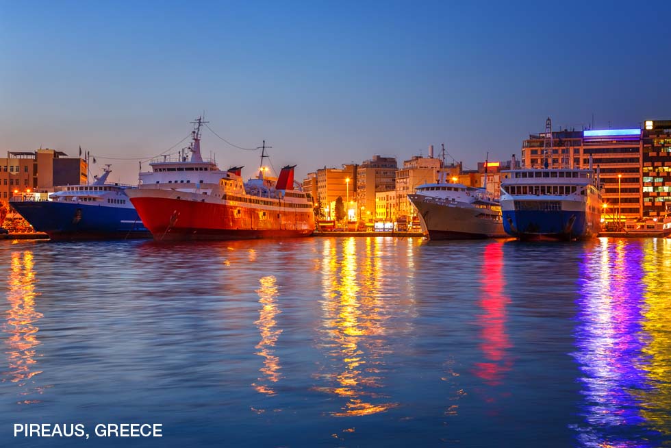 Piraeus at night with cruise ships