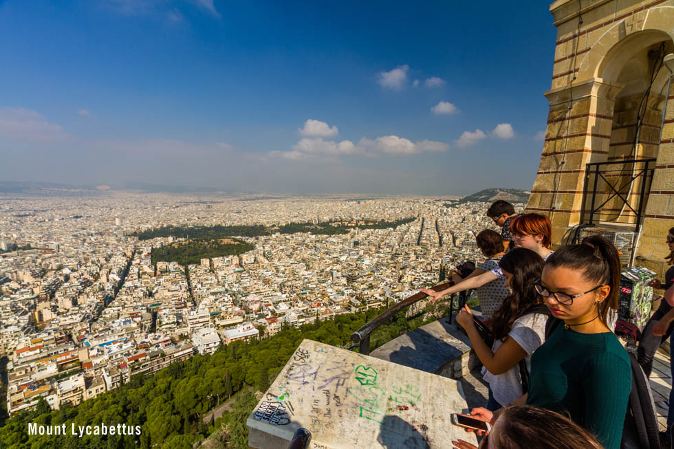 Tourists viewing Athens from atop Mount Lycabettus
