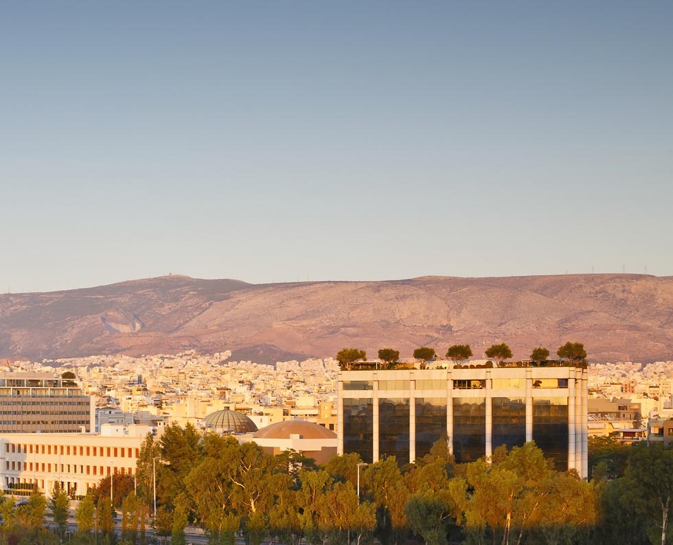 Panoramic of Athens Greece with snow-capped mountains