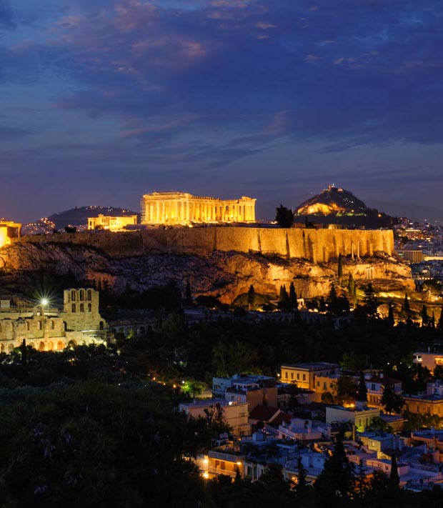 Glowing lights at night on the Acropolis in Athens Greece