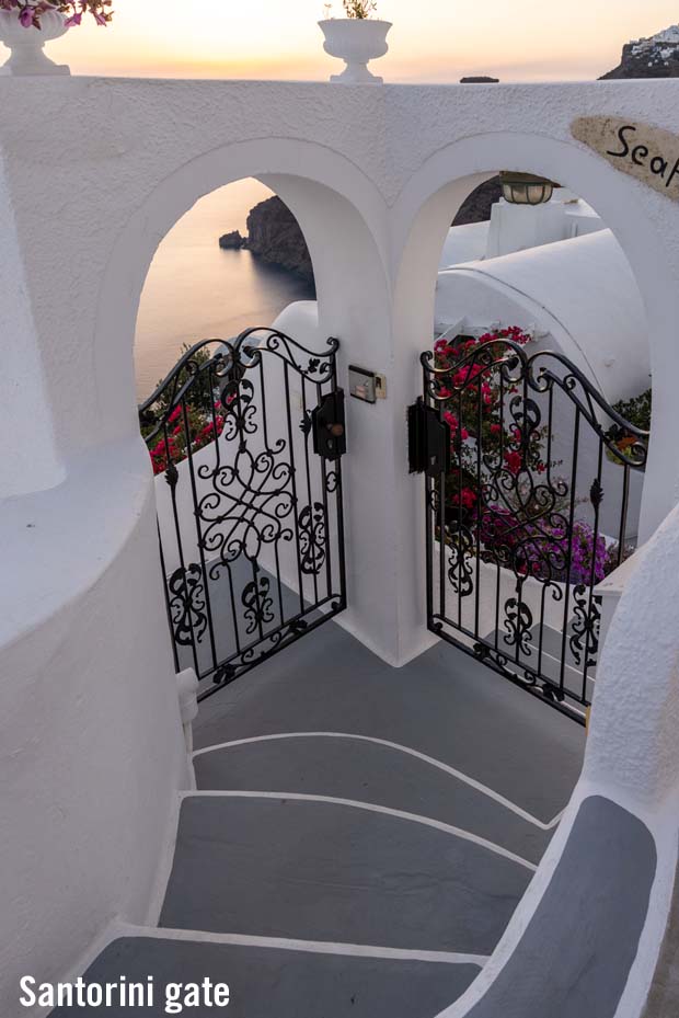 Elegant wrought iron gateway on Santorini