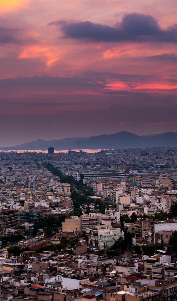 Athens Greece sunset looking toward the West and Saronic Gulf with Piraeus Athens Greece sunset looking toward the West and Saronic Gulf with Piraeus
