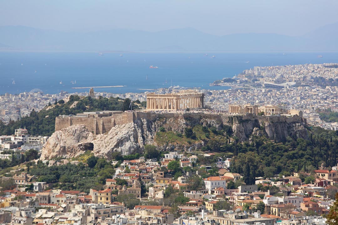 Sunny skies over Athens Greece and the Saronic Gulf with the Acropolis in view Sunny skies over Athens Greece and the Saronic Gulf with the Acropolis in view
